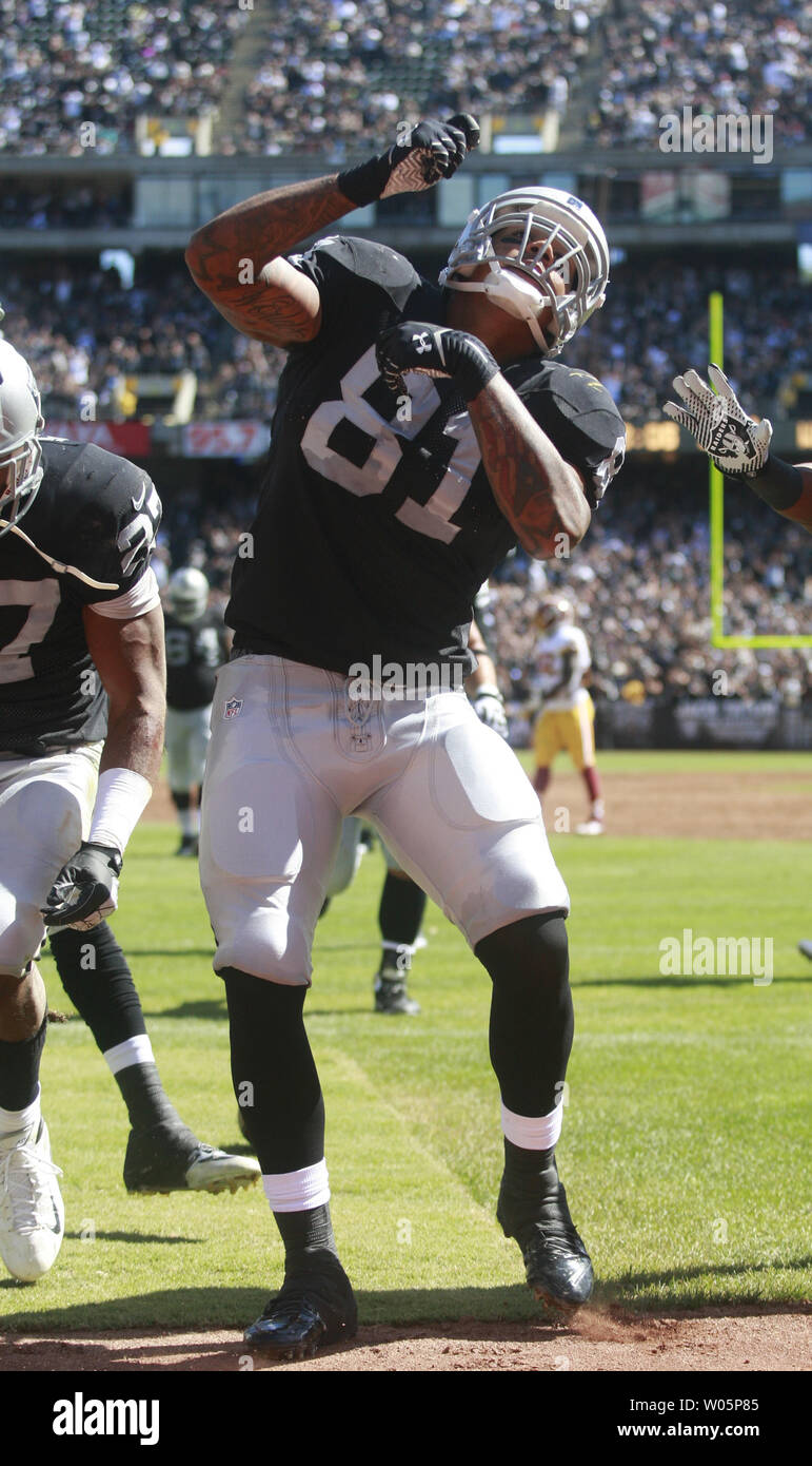 Oakland Raiders Mychal Rivera (81) celebrates an 18 yard TD pass from QB Matt Flynn in the first quarter against the Washington Redskins at O.co Coliseum in Oakland, California on September 29, 2013. The Redskins defeated the Raiders 24-14.    UPI/Bruce Gordon Stock Photo