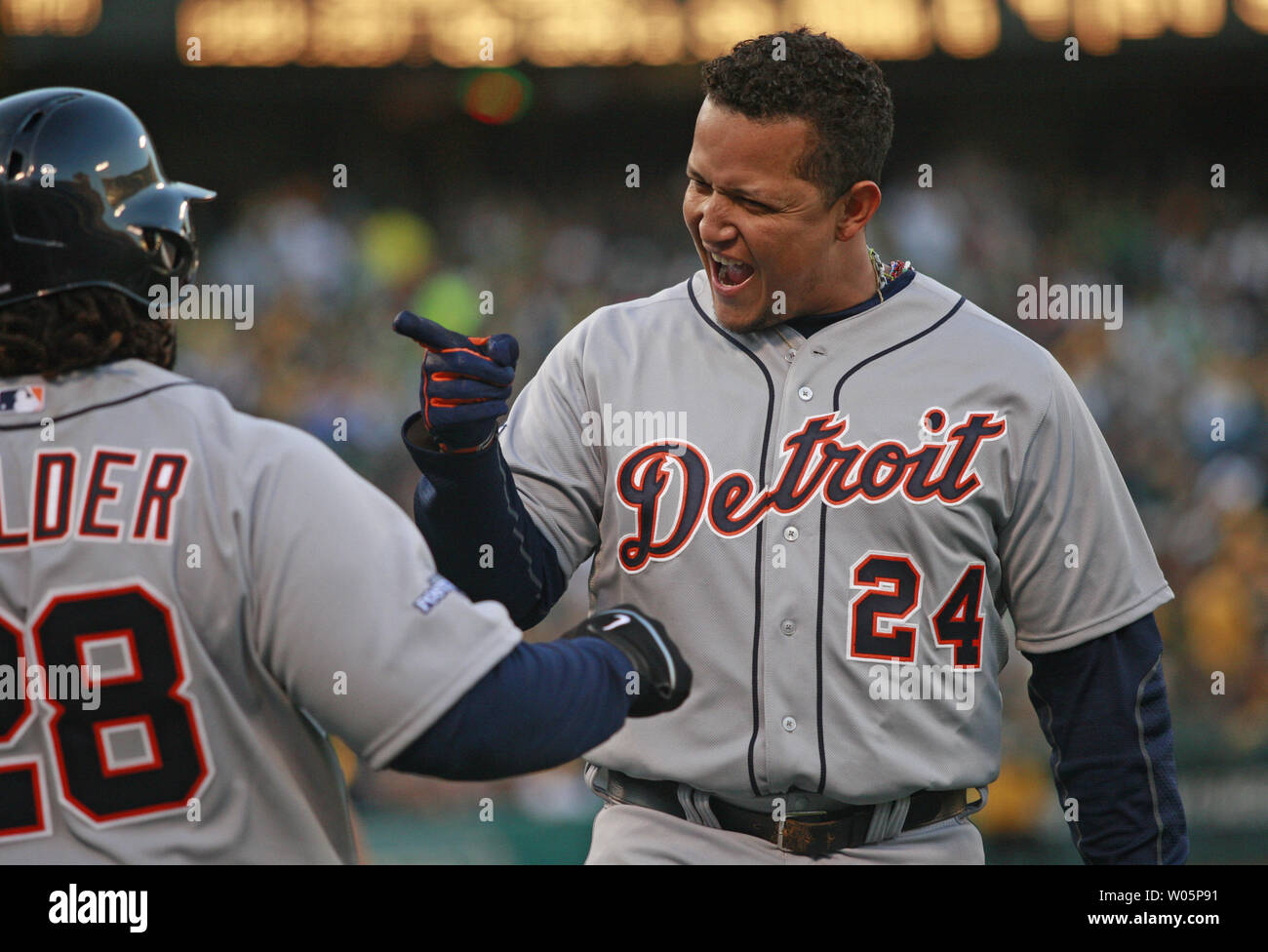 Detroit Tigers Miguel Cabrera (24) celebrates a fourth inning two run home run off Oakland A's Sonny Gray with Tigers Prince Fielder  in game 5 of the American League Division Series at O.co Coliseum in Oakland, California on October 10, 2013.     UPI/Bruce Gordon Stock Photo