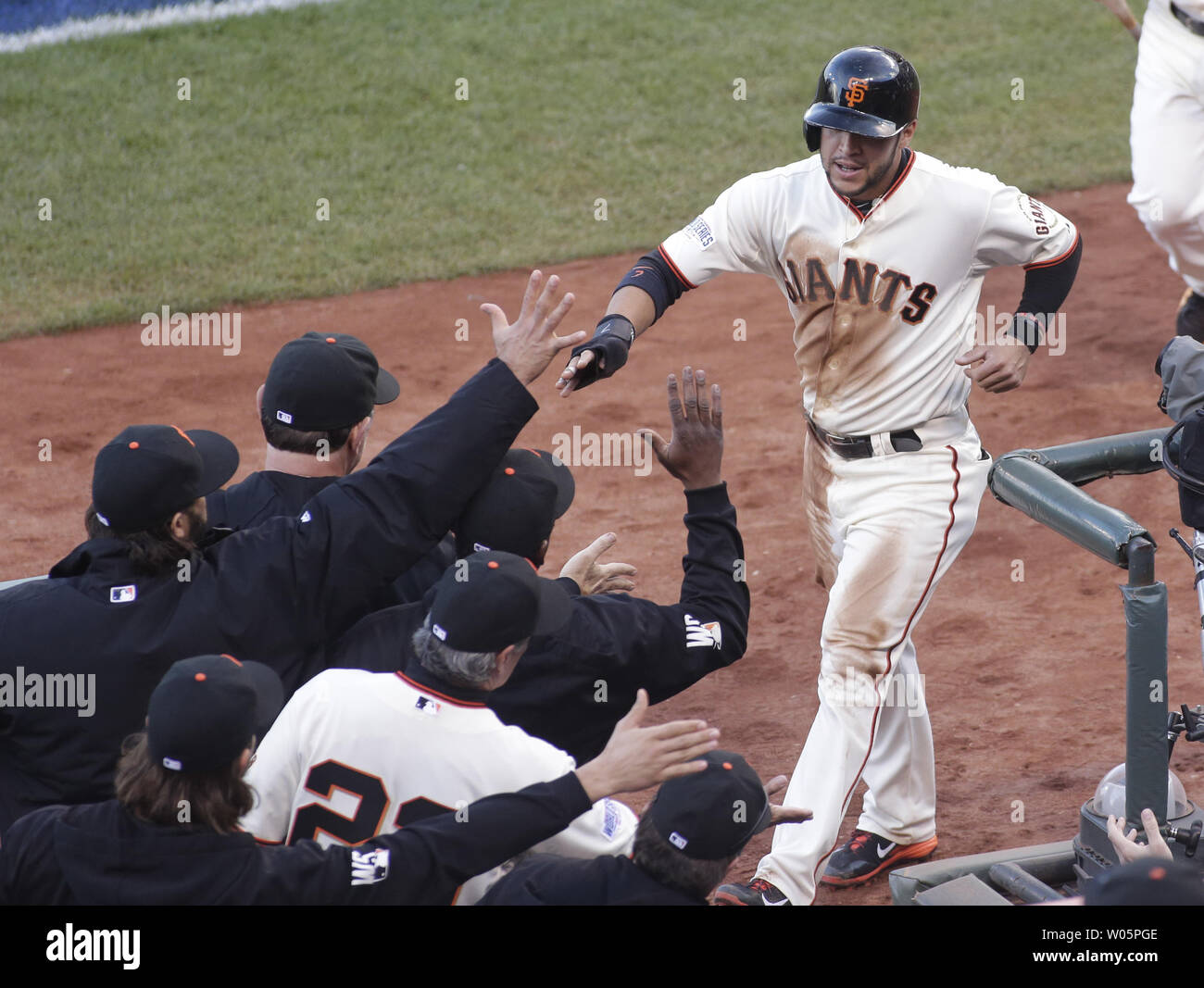 San Francisco Giants Gregor Blanco is congratulated at the dugout after scoring against the Kansas City Royals in the first inning of game 4 of the World Series at AT&T Park in San Francisco on October 25, 2014. The Giants evened the Series with an 11-4 win.     UPI/Bruce Gordon Stock Photo