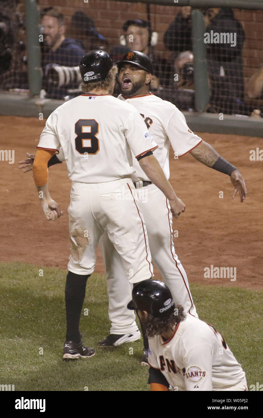 San Francisco Giants Hunter Pence (L) celebrates with Pablo Sandoval after they scored on a double by Juan Perez off Kansas City Royals pitcher Wade Davis in the eighth inning of game 5 of the World Series at AT&T Park in San Francisco on October 26, 2014. The Giants defeated the Royals 5-0.   UPI/Bruce Gordon Stock Photo