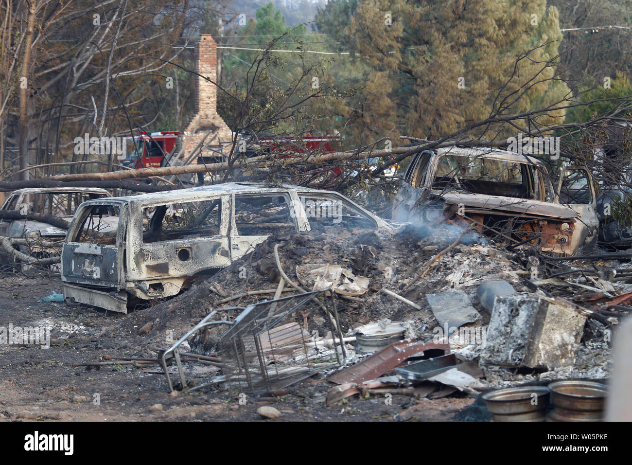 The burned remains of houses and vehicles sit destroyed by the Valley