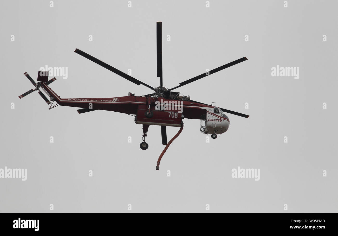 A specialized helicopter flies overhead during the Valley Fire in ...