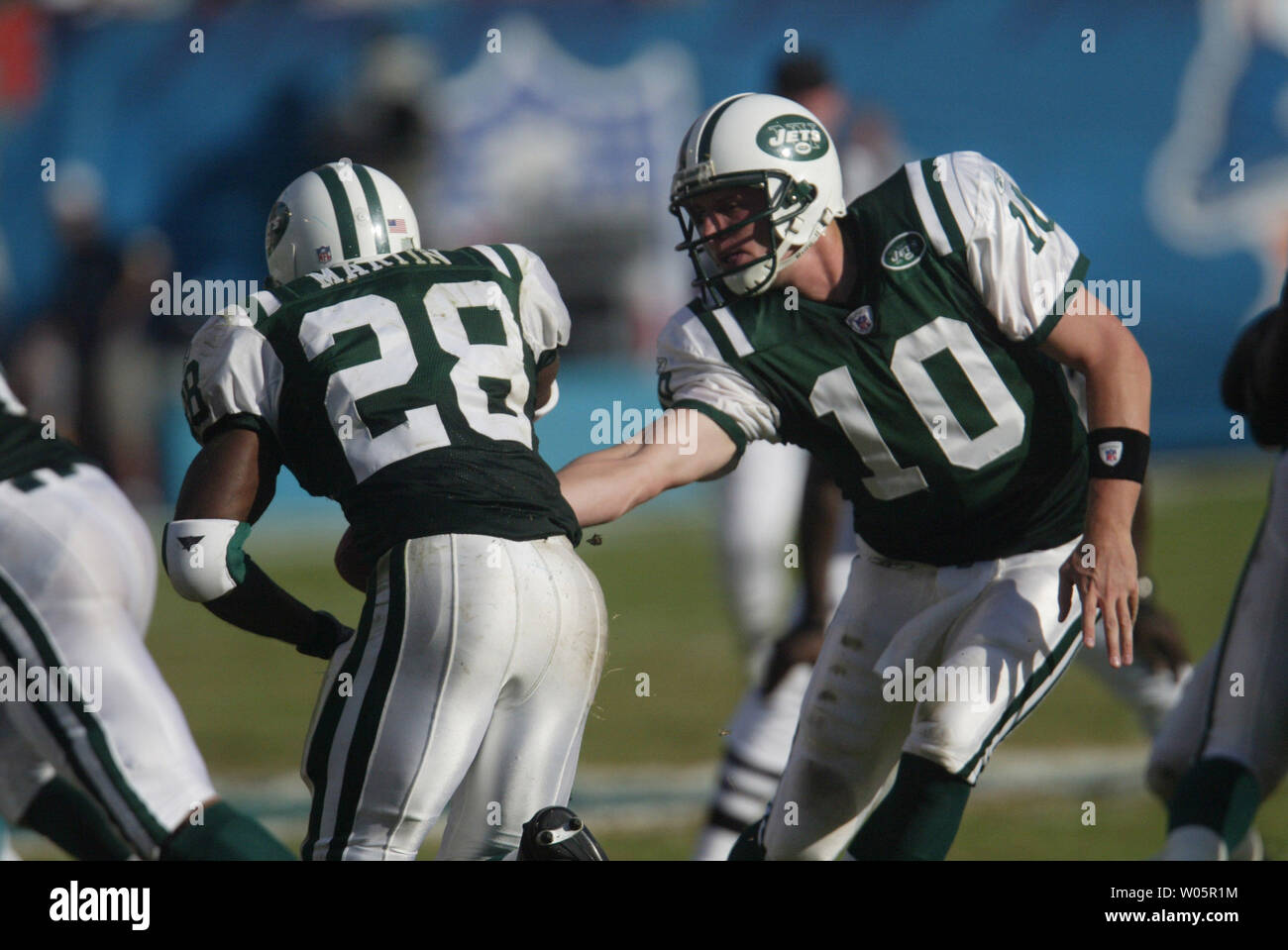 New Jets quarterback Chad Pennington (10) hands off to running back Curtis  Martin (28) against the Miami Dolphins October 3 2004 at Pro Player Stadium  in Miami Fl. The New York Jets