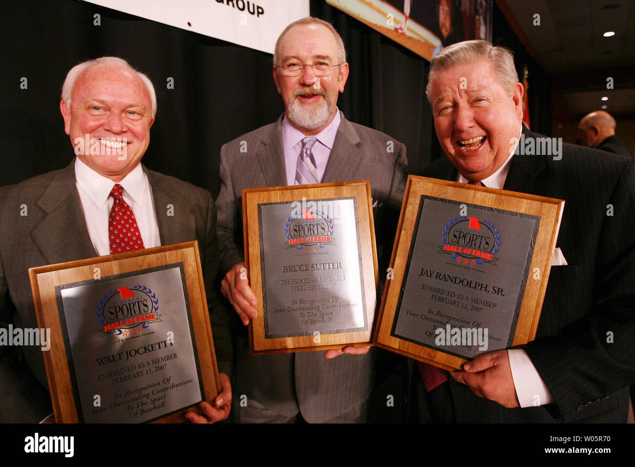 Several new members of the Missouri Sports Hall of Fame (L to R) St. Louis Cardinals General Manager Walt Jocketty, former St. Louis Cardinals pitcher and member of the National Baseball Hall of Fame Bruce Sutter and broadcaster Jay Randolph, Sr. show off their placques following the Enshrinement Banquet and ceremonies in Springfield, Missouri on February 11, 2007. A total of 15 new members with sports related backrounds will enter as the class of 2007. (UPI Photo/Bill Greenblatt) Stock Photo