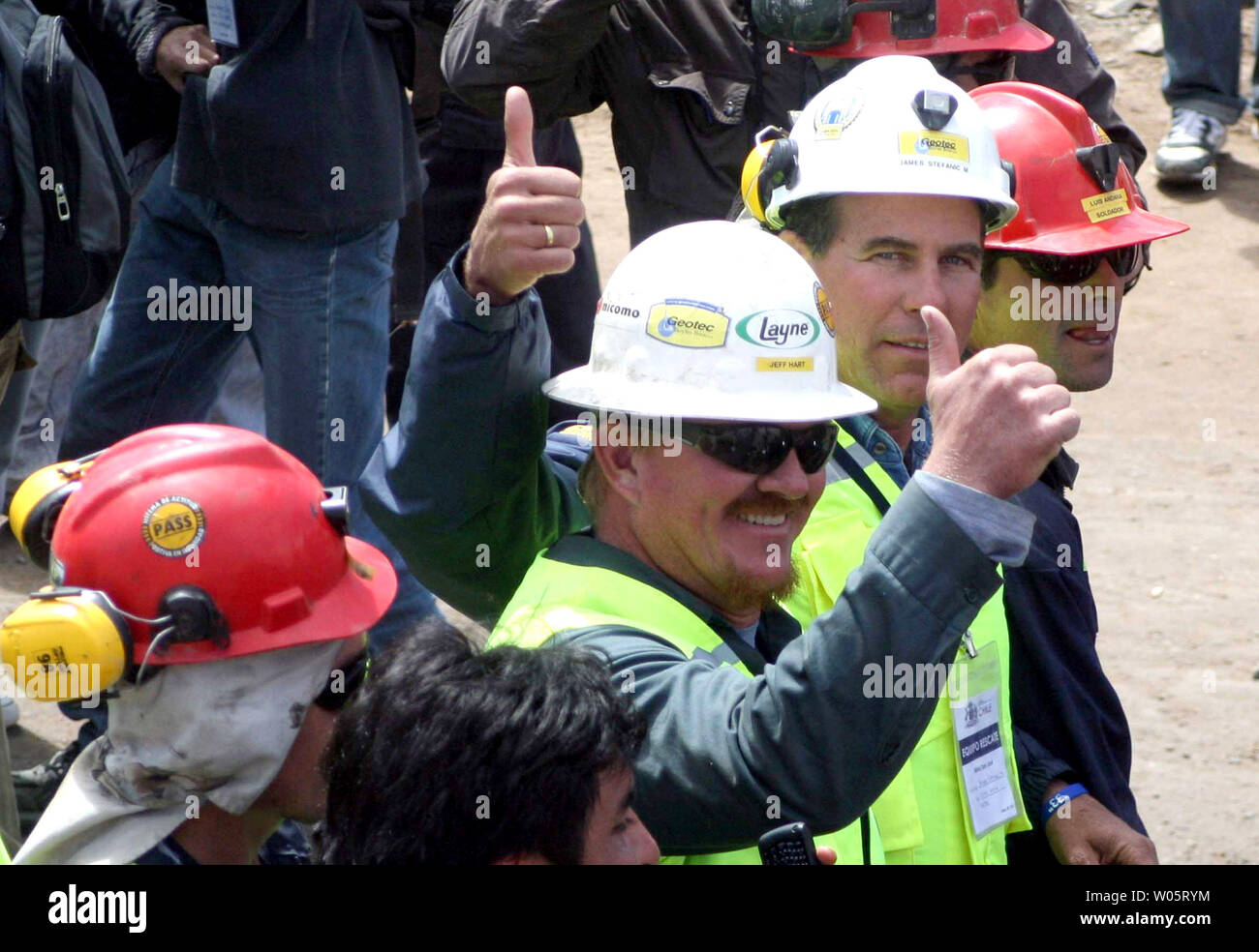 Mine workers give the 'thumbs-up' as preparations continue to rescue the 33 trapped miners at San Jose Mine, Chile on October 11, 2010.   If all goes well, officials say the first miners will be brought up in a few days via a 20-minute ride in a rescue capsule more than 2,000 feet below the surface.   The miners have been trapped for more than two months.   UPI/Sebastian Padilla Stock Photo