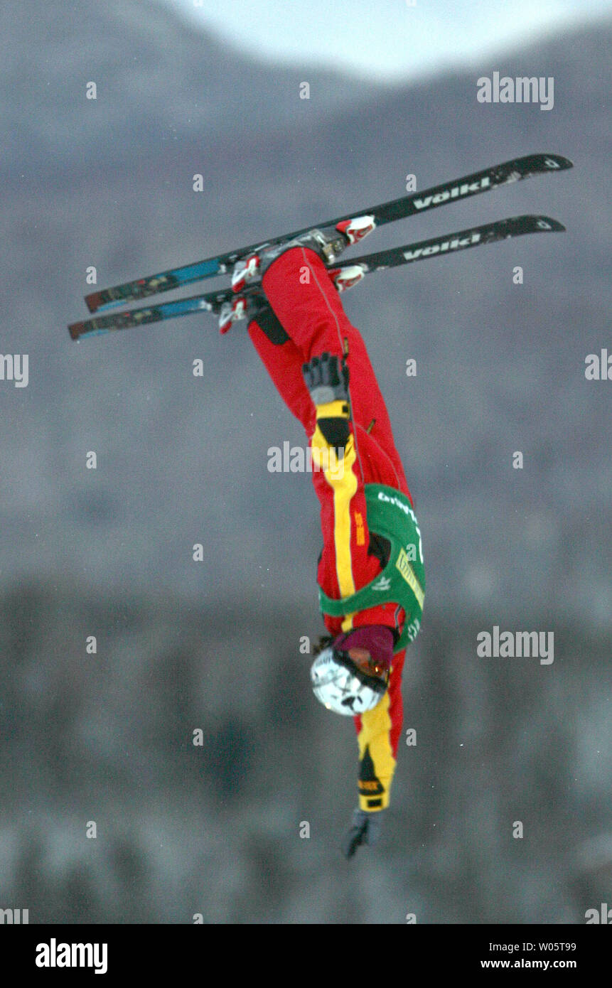 Chinese aerialist LI Nina, 22, performs a triple-twisting double somersault en route to winning the gold medal at the Freestyle World Cup event in Lake Placid, NY on January 14, 2005.  Miss Li of Shenyang, China, tallied 96.56 points ahead of Australian Lydia Ierodiaconou (94.25) who leads the world cup standings.  (UPI Photo/Grace Chiu) Stock Photo