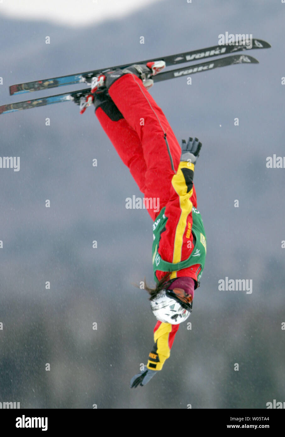 Chinese aerialist Li Nina, 22, performs a triple-twisting double somersault en route to winning the Freestyle World Cup event in Lake Placid, NY on January 16, 2005.  Miss Li, who comes from Shenyang, China, totalled 186.72 points in two jumps to win over #1-ranked Lydia Ierodiaconou of Australia (186.01).  (UPI Photo/Grace Chiu) Stock Photo