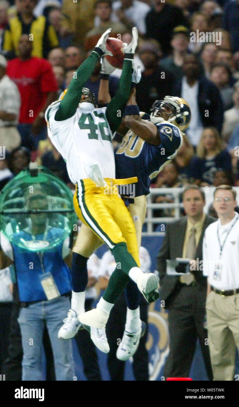 Former St. Louis Rams Isaac Bruce holds the Super Bowl trophy during  ceremonies celebrating the teams Super Bowl victory in the 1999-2000  season, at the Edward Jones Dome during half time of