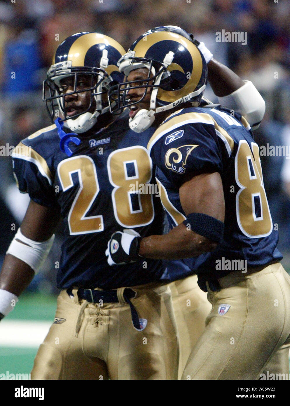 St. Louis Rams Marshall Faulk (L) congratulates Isaac Bruce after Bruce  scored a touchdown against the Seattle Seahawks in the first quarter at the  Edward Jones Dome in St. Louis on December