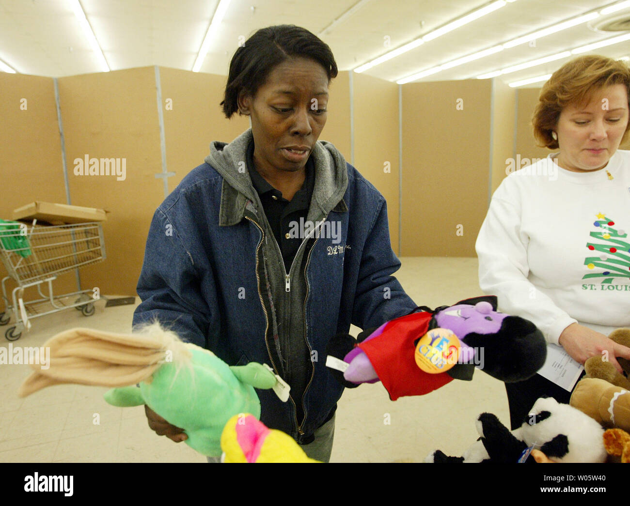 Vivian Lewis (L) tries to decide which stuffed animal to select for her