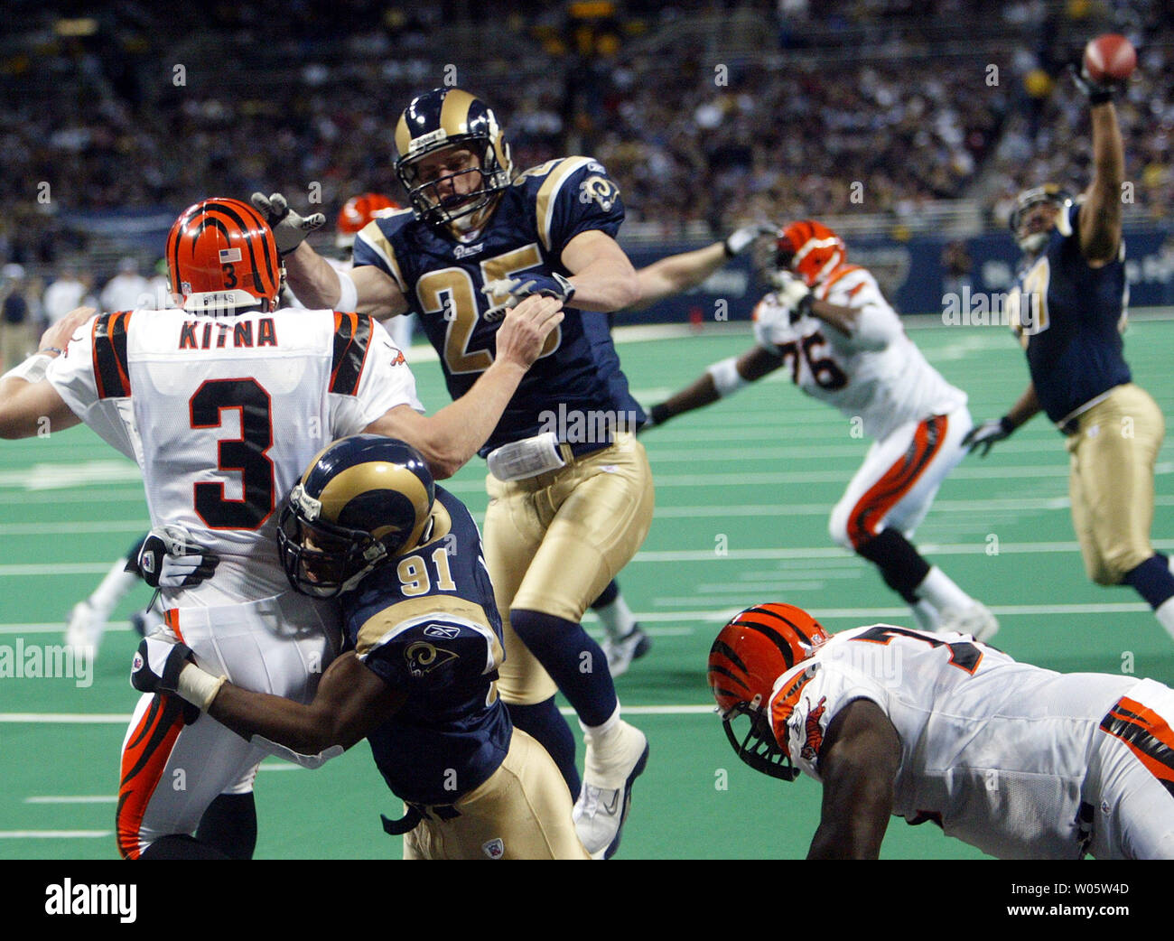 St Louis Rams Leonard Little 91 And Rich Cody 25 Pressure Cincinnati Bengals Quarterback Jon Kitna To Throw Wild As Rams Tyoka Jackson Just Gets A Finger On The Pass In The St Louis Rams Leonard Little 91 And Rich Cody 25 Pressure Cincinnati Bengals Quarterback Jon Kitna To Throw Wild As Rams Tyoka Jackson Just Gets A Finger On The Pass In The