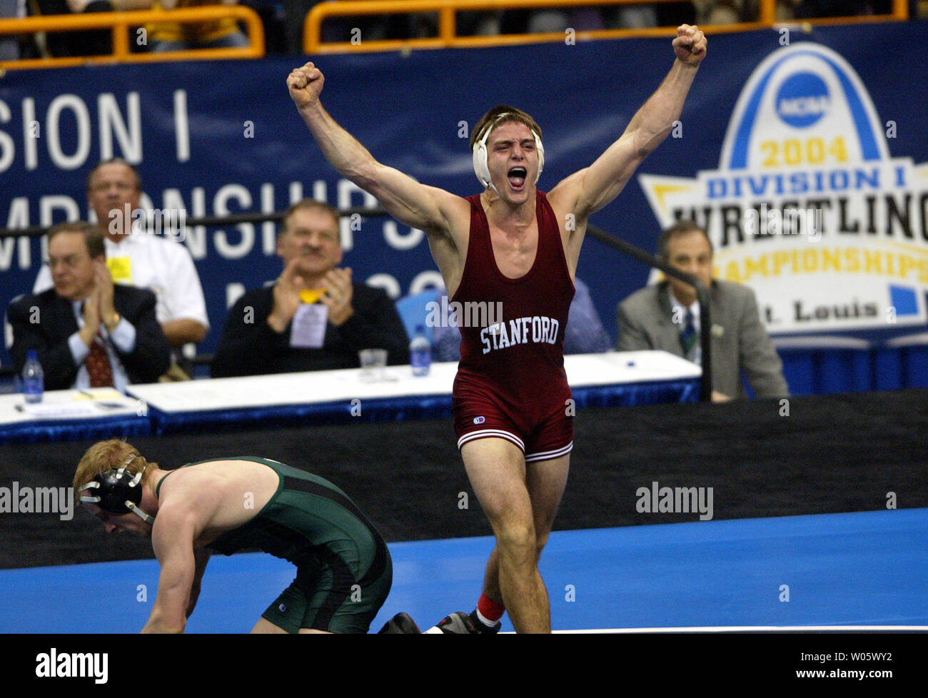 Jake Percival Stanfords' Matt Gentry (R) gives out a yell after defeating Jake ...