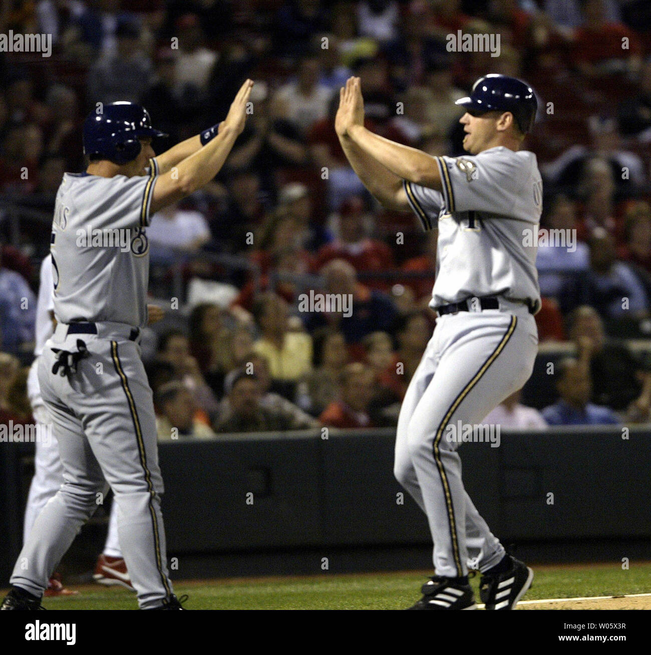 Milwaukee Brewers J.J. Hardy gets a fist with thumbs up from first base  coach Eddie Sedar after hitting a two run RBI single off of St. Louis  Cardinals pitcher Todd Wellemeyer in