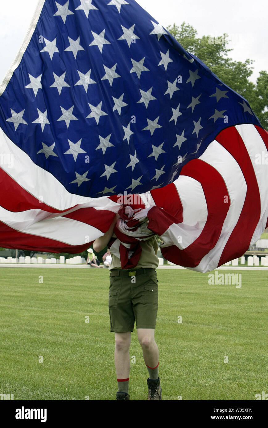 Eagle Scout Greg Lehn Becomes Surrounded By An Oversized American Flag Before A Ceremony At Jefferson Barracks Natoinal Cemetery In St Louis County Mo On May 30 04 Approximately 4000 Scouts Gather