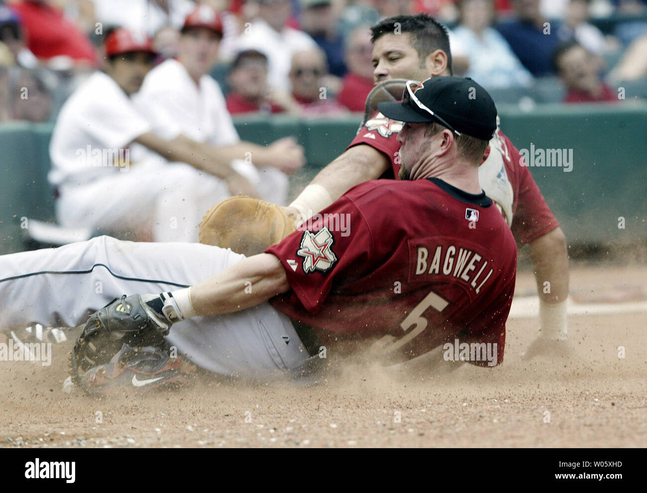 Houston Astros Jeff Bagwell (5) and catcher Raul Chavez make a sliding attempt on a foul ball hit by St. Louis CardInals Edgar Renteria in the fifth inning at Busch Stadium in St. Louis on June 6, 2004. The ball fell just short of Bagwell's glove.  (UPI Photo/Bill Greenblatt) Stock Photo