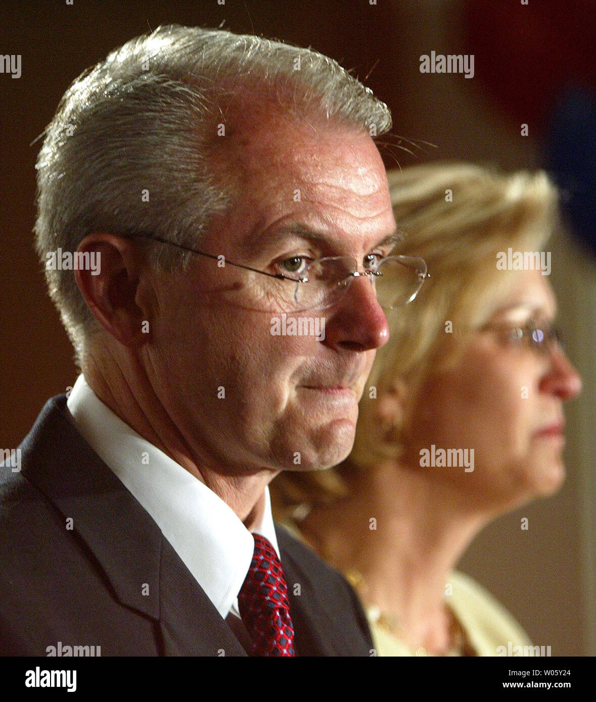 A tearful Missouri Gov. Bob Holden and wife Lori Hauser Holden pause during a moment of applause during a concession speech at the Electrical Workers Hall in St. Louis on August 3, 2004.  Holden lost a tight race with state auditor Claire McCaskill in the Democratic primary.  (UPI Photo/Bill Greenblatt) Stock Photo