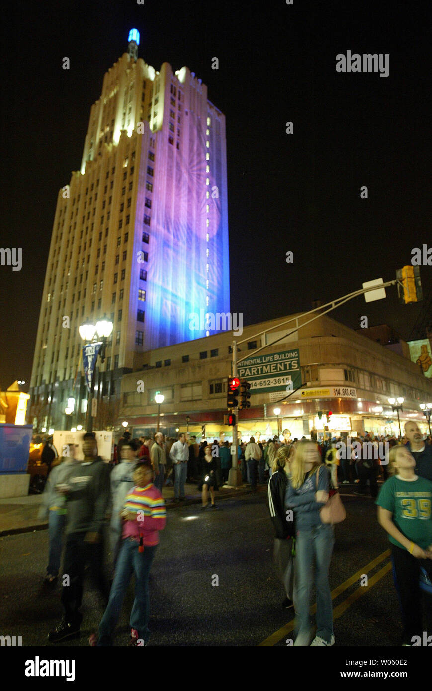 Thousands meander on Grand Avenue enjoying the 60 degree temperatures during First Night St. Louis in St. Louis on December 31, 2004. First Night St. Louis is a alcohol-free, visual and performing arts festival geared toward family oriented actvities to welcome the New Year. (UPI Photo/Bill Greenblatt) Stock Photo