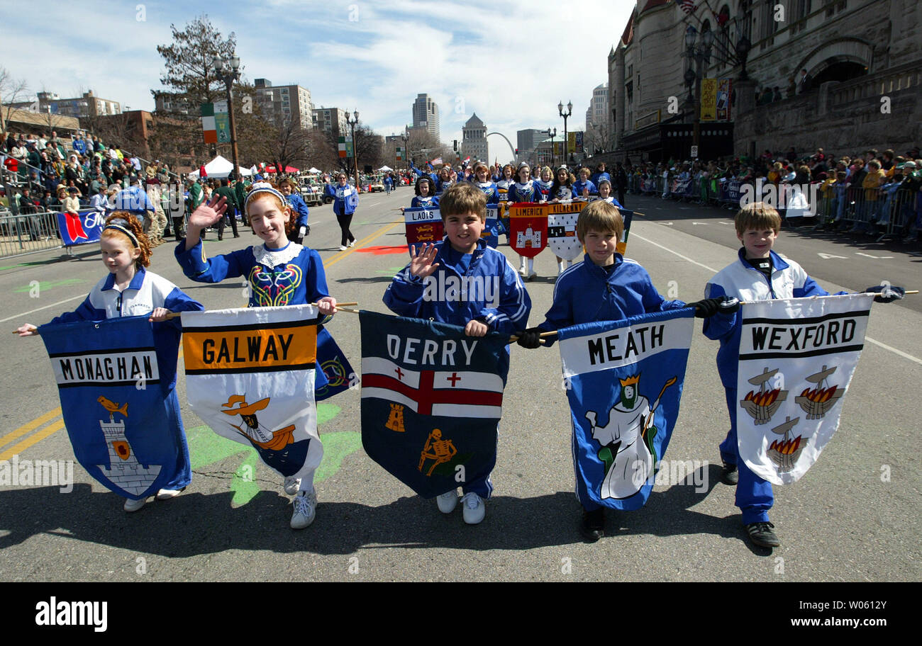 Children carry banners with the names of Irish counties during the start of the St. Patrick's Day Parade in St. Louis on March 12, 2005. (UPI Photo/Bill Greenblatt) Stock Photo