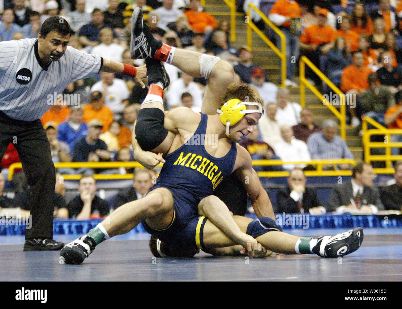 Ryan Bertin of Michigan (top) turns Joe Johnston of Iowa upside down during  their 157 pound match during the 2005 NCAA Division 1 Wrestling  Championships at the Savvis Center in St. Louis