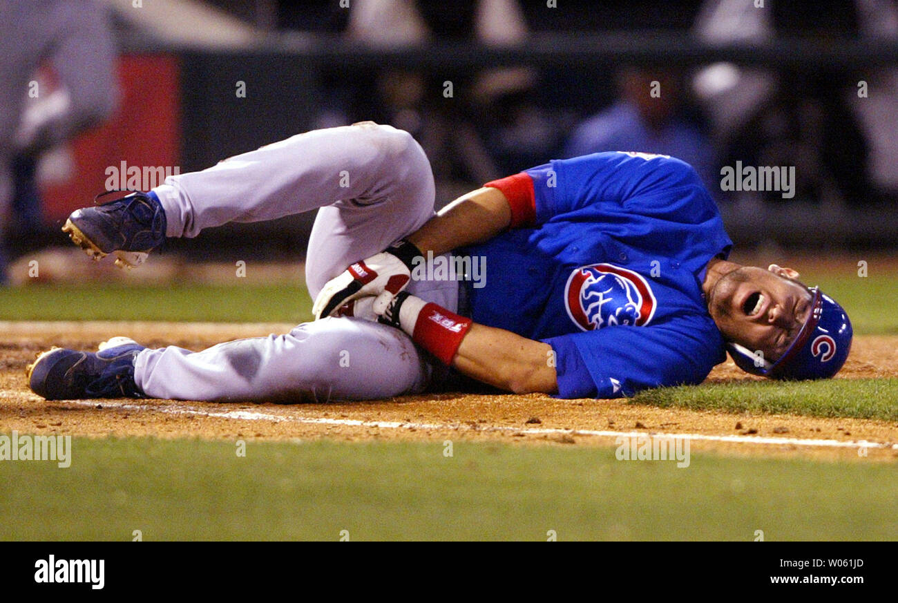 https://c8.alamy.com/comp/W061JD/chicago-cubs-nomar-garciaparra-falls-to-the-ground-in-pain-injuring-his-left-groin-after-hitting-into-a-double-play-against-the-st-louis-cardinals-in-the-third-inning-at-busch-stadium-in-st-louis-on-april-20-2005-upi-photobill-greenblatt-W061JD.jpg