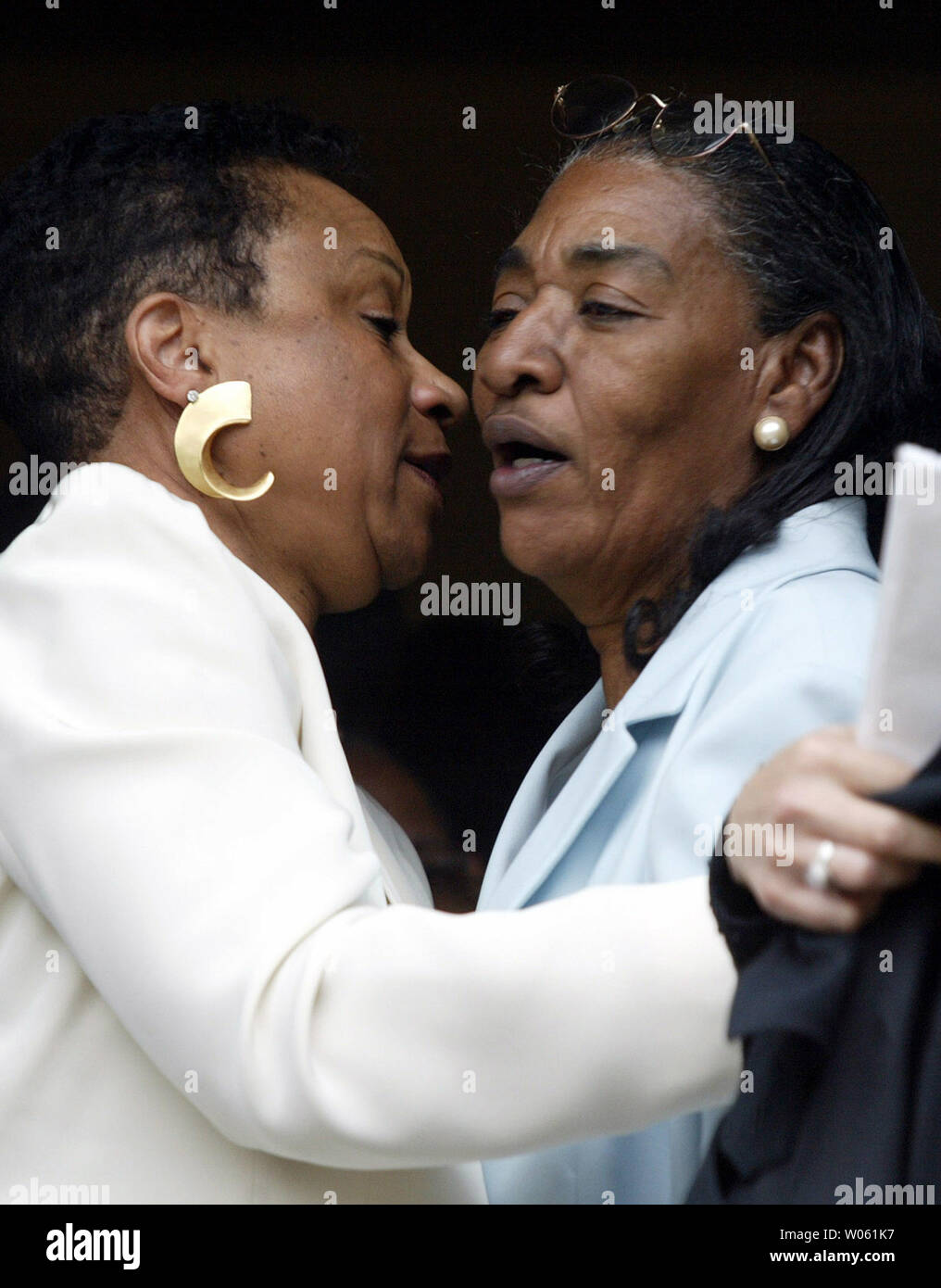 Frances Johnson (R) widow of pianist Johnnie Johnson receives a hug from a friend following a funeral service at the St. Paul Lutheran Church in St. Louis on April 22, 2005. Hundreds of friends and those in the music business paid their respects to the original boogie-woogie piano player who inspired many. Johnson played with rock n' roller Chuck Berry for nearly 30 years. (UPI Photo/Bill Greenblatt) Stock Photo