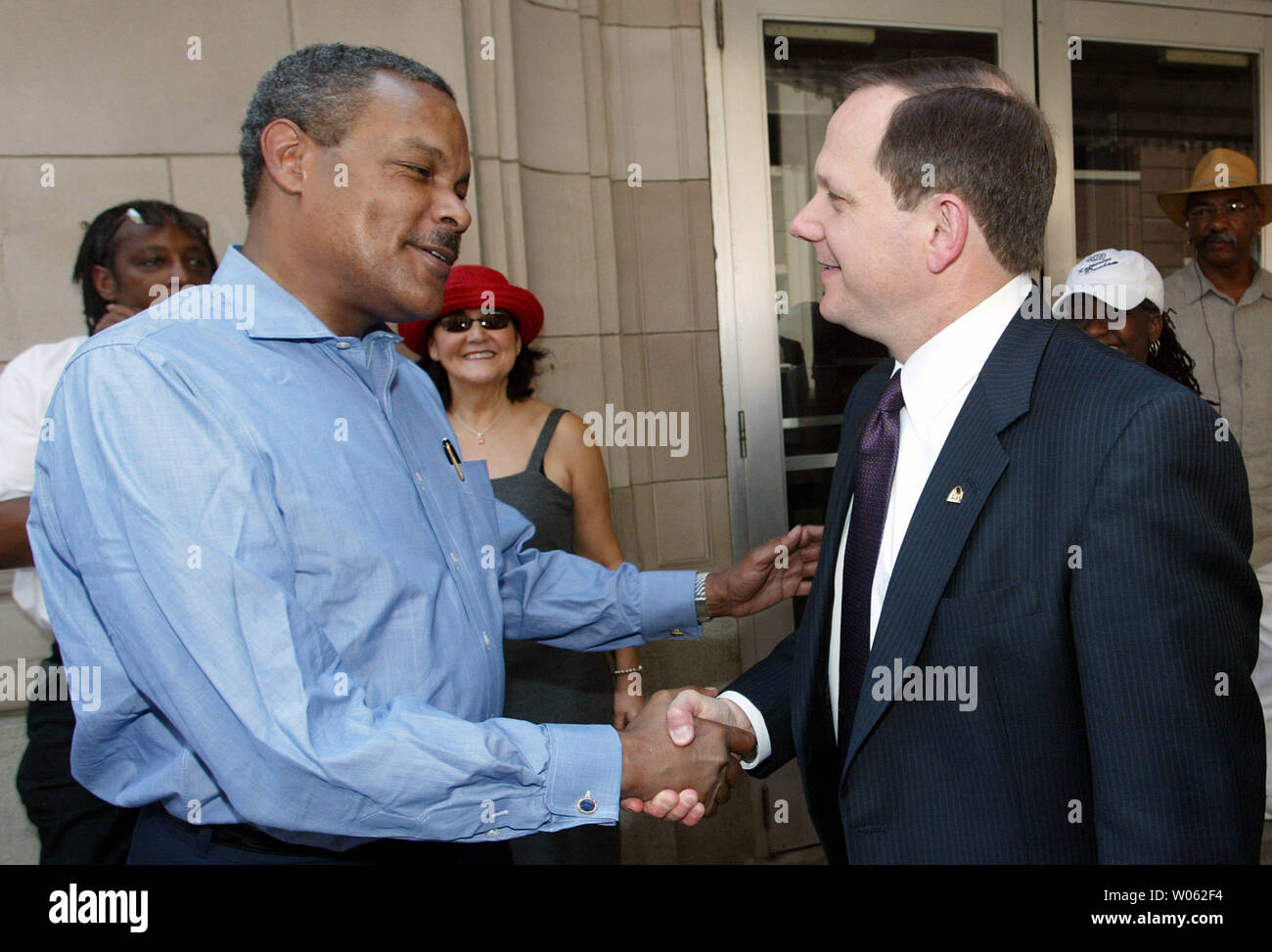 St. Louis mayor Francis Slay (R) greets East St. Louis Illinois mayor Carl Officer before a ceremony for dancer Katherine Dunham in St. Louis on June 24, 2005. Dunham, 96, a modern dance legend, is moving back to nearby East St. Louis, IL from New York. (UPI Photo/Bill Greenblatt) Stock Photo