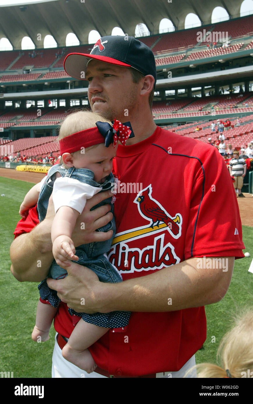 St. Louis Cardinals Scott Rolen hold his seven month old daughter