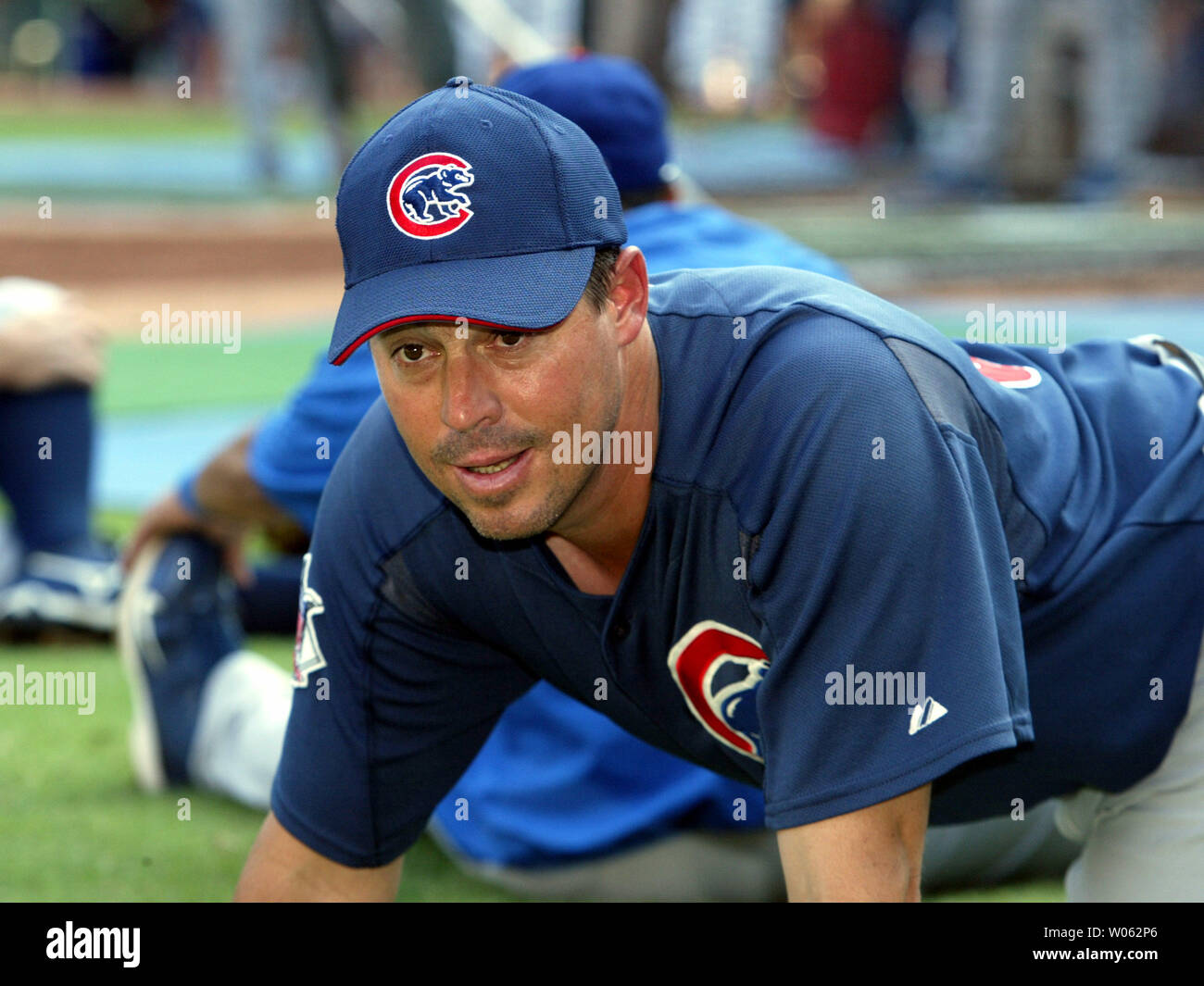 Chicago Cubs pitcher Greg Maddux stretches before a game against the St