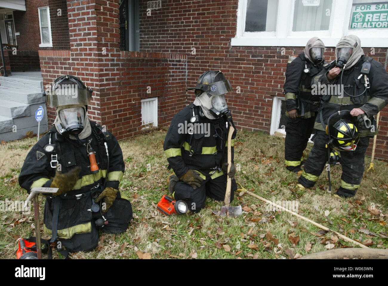 Members of Rescue Squad One of the St. Louis Fire Department, wait