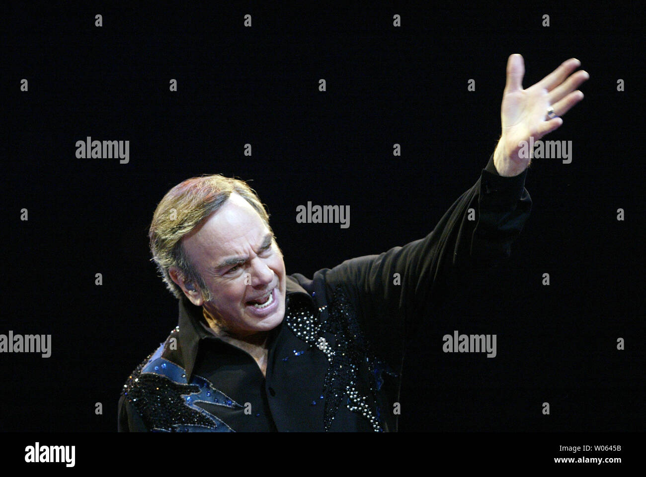 Singer Neil Diamond entertains the crowds at the Savvis Center during