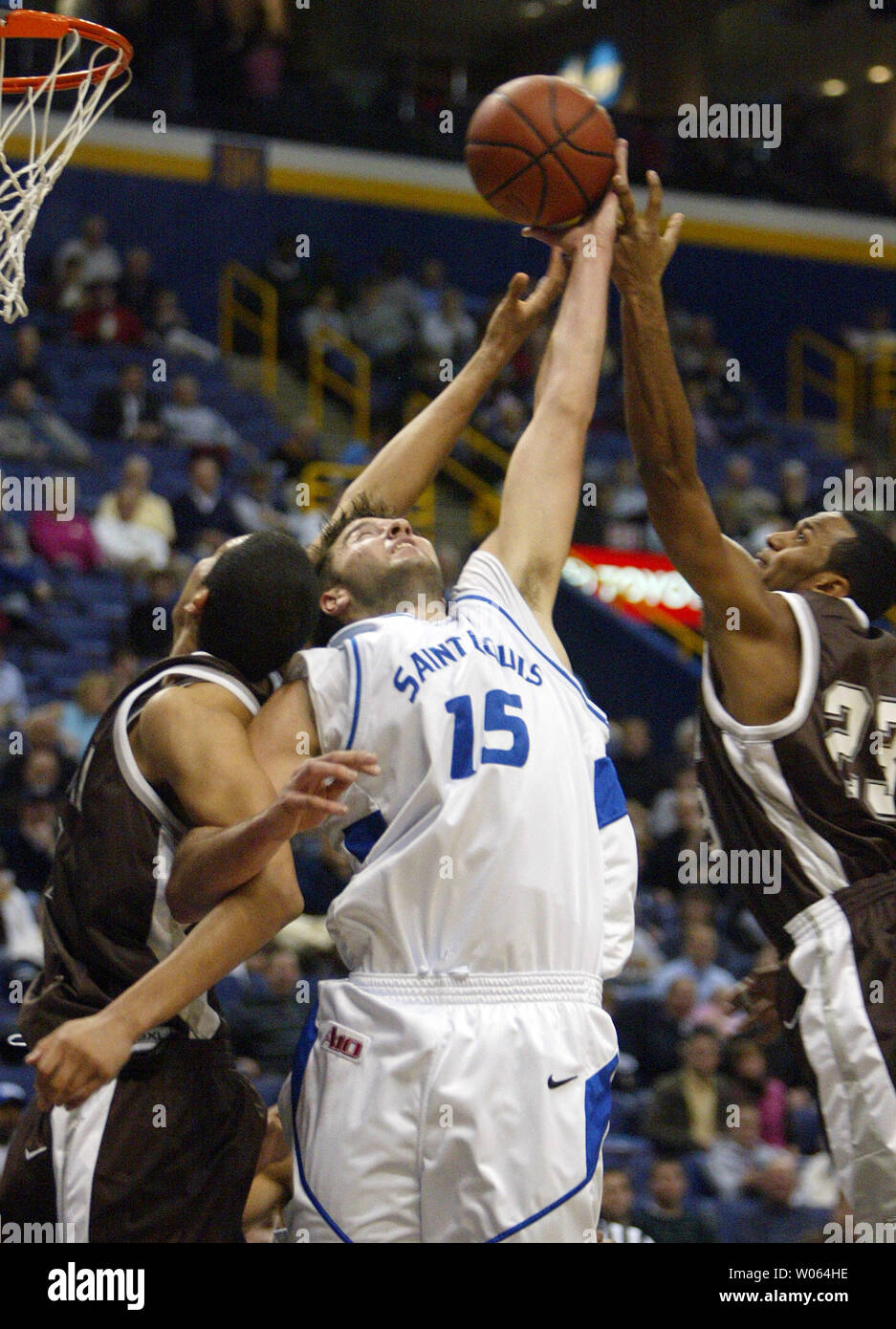 Saint Louis University Billikens Ian Vouyoukas (15) battles St. Bonaventure Bonnies' Paul Williams (L) and Wade Dunston (R) for the rebound in the first half at the Savvis Center in St. Louis on January 3, 2006. (UPI Photo/Bill Greenblatt) Stock Photo