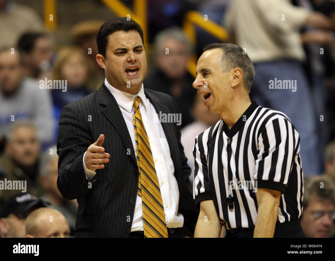 Xavier Musketeers head basketball coach Sean Miller (L) has words with  official Mike Sanzere during the second half against the Saint Louis  University Billikens at the Savvis Center in St. Louis on