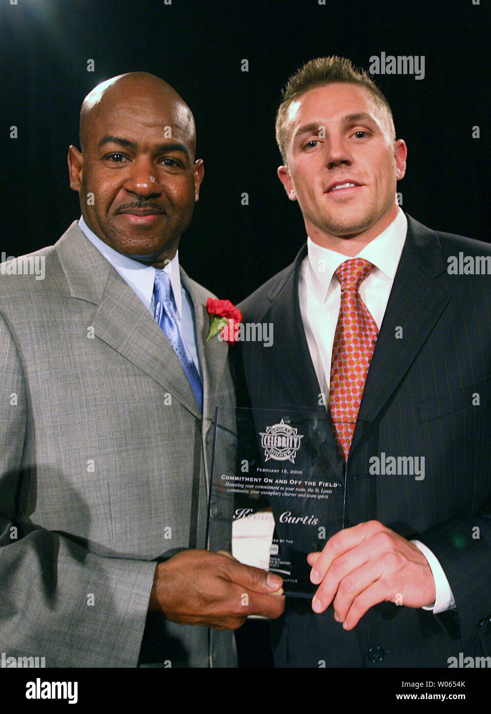 Los Angeles Rams Hall of Famer Tom Mack stands with his bust as