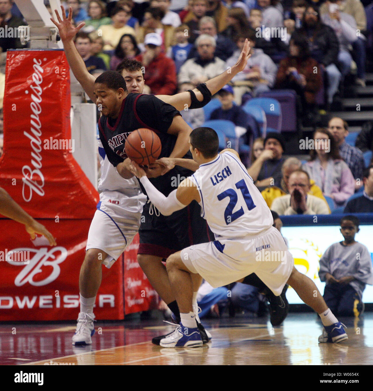 Saint Louis University's Ian Vouyoukas defends while Kevin Lisch (21) takes  the basketball away fromTemple's Wayne Marshall during the first half at  the Savvis Center in St. Louis on February 18, 2006. (