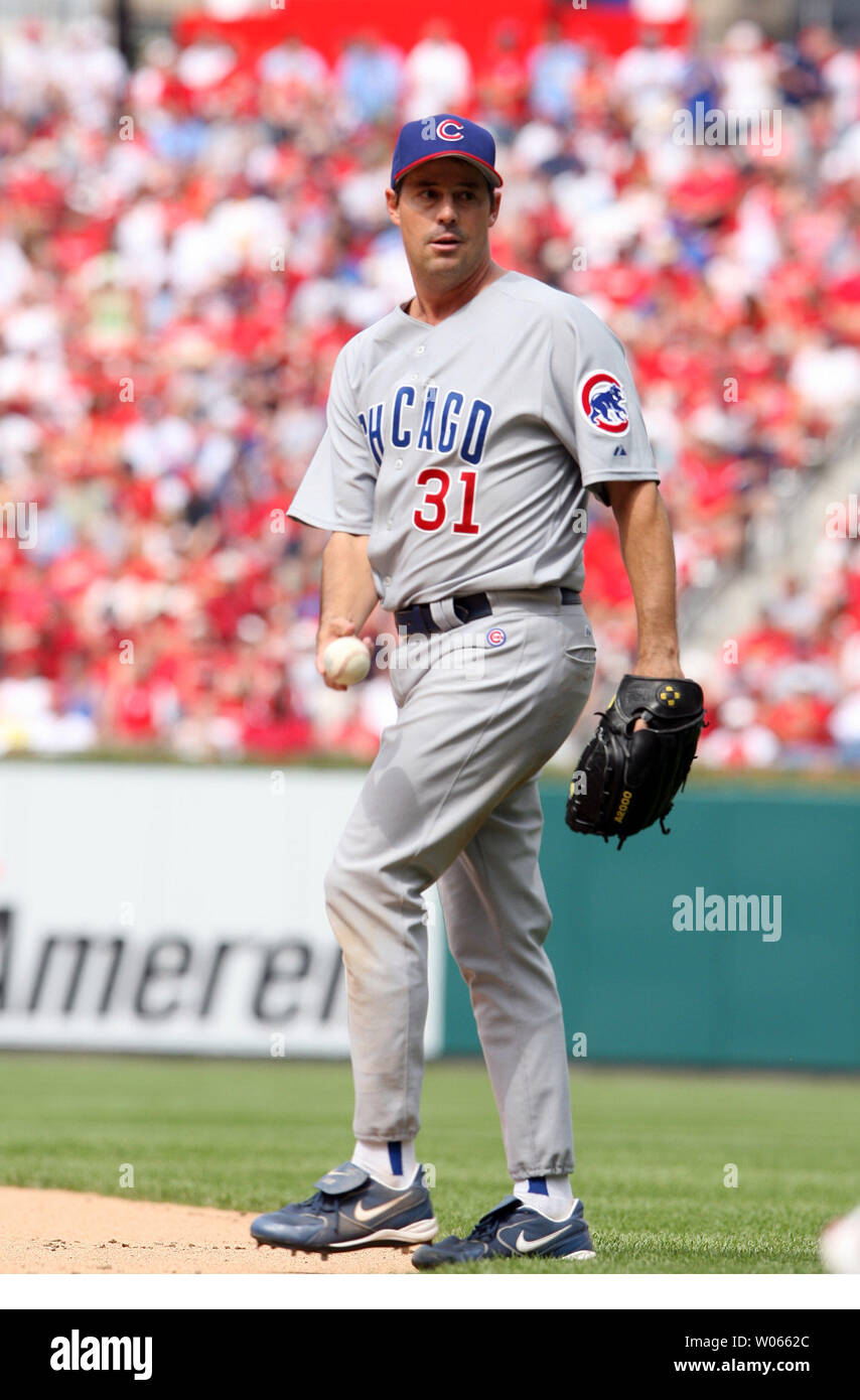 Chicago Cubs pitcher Greg Maddux assists with a play against the St