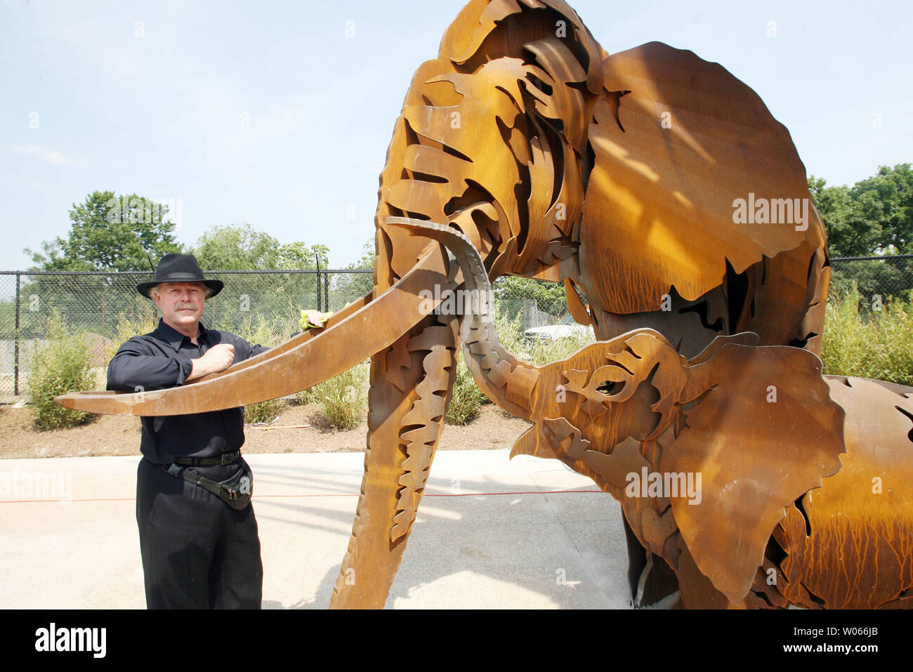 Sculptor Albert Paley from Rochester, NY, stands with the elephants at ...