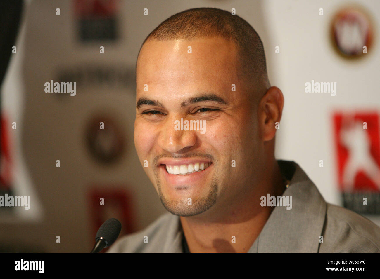 St. Louis Cardinals Albert Pujols smiles big after  announcing he will open a resturant in the fall called PUJOLS FIVE, in the Westport area of St. Louis on June 1, 2006. Pujols hopes that the resturant will help fund the Pujols Family Foundation's 501C3 organization. (UPI Photo/Bill Greenblatt) Stock Photo