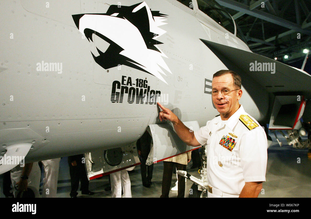 Admiral Michael Mullen, Chief of Naval Operations for the United States Navy, gets a closer look at the new EA-18G Growler airborne electronic aircraft, at the  Boeing aircraft assembly plant in St. Louis on August 3, 2006. The plane is a two-seat F/A-18F Super Hornet with an advanced weapons, sensors and communications systems. (UPI Photo/Bill Greenblatt) Stock Photo