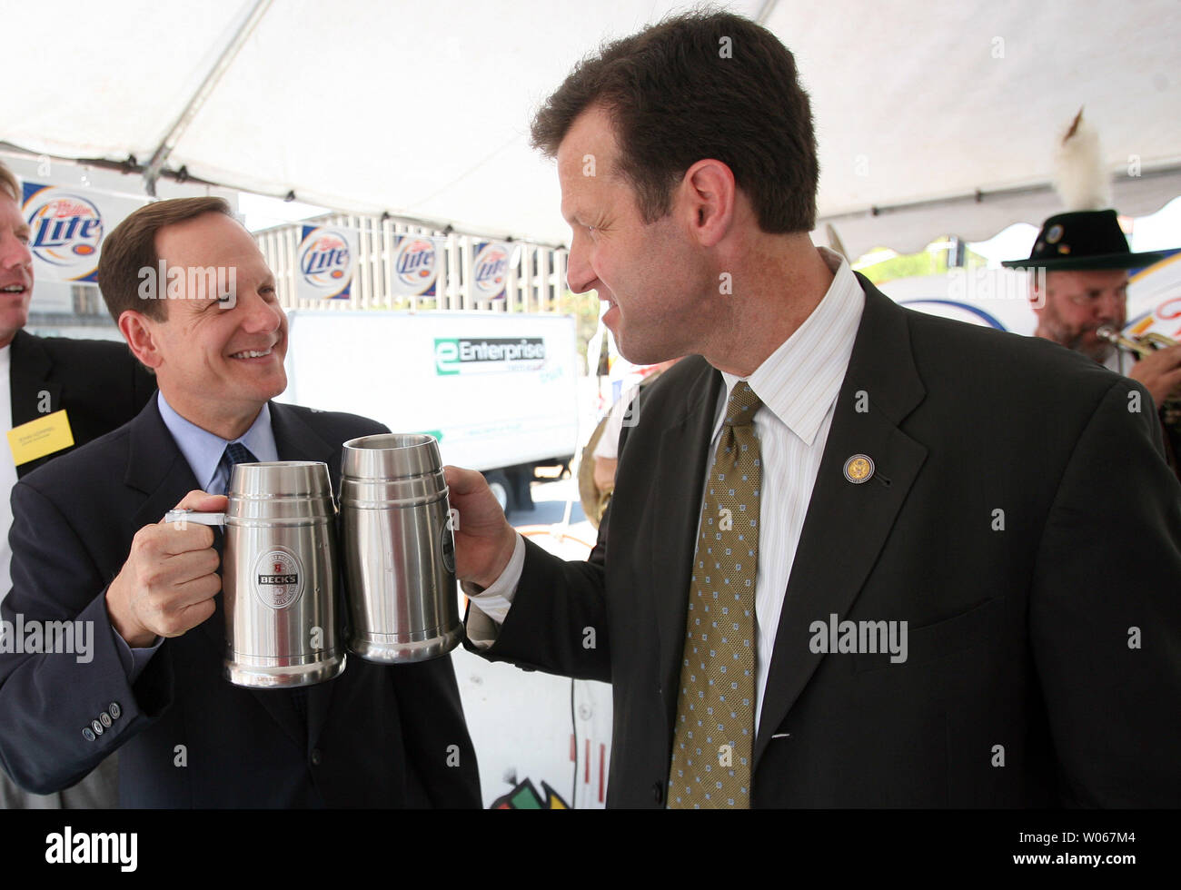 St. Louis Mayor Francis Slay (L) toasts U.S. Rep. Russ Carnahan as the St. Louis Strassenfest opens in downtown St. Louis on August 4, 2006. The three-day event celebrates German hertiage with beer, brats and alot of umpah music. (UPI Photo/Bill Greenblatt) Stock Photo