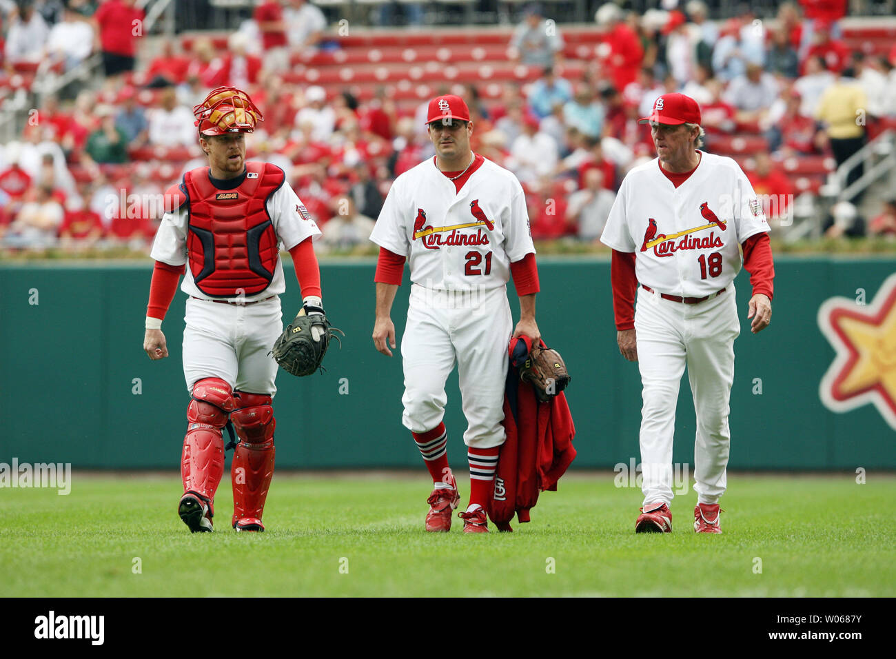 St. Louis Cardinals pitcher Jason Marquis (L) walks to the dugout with
