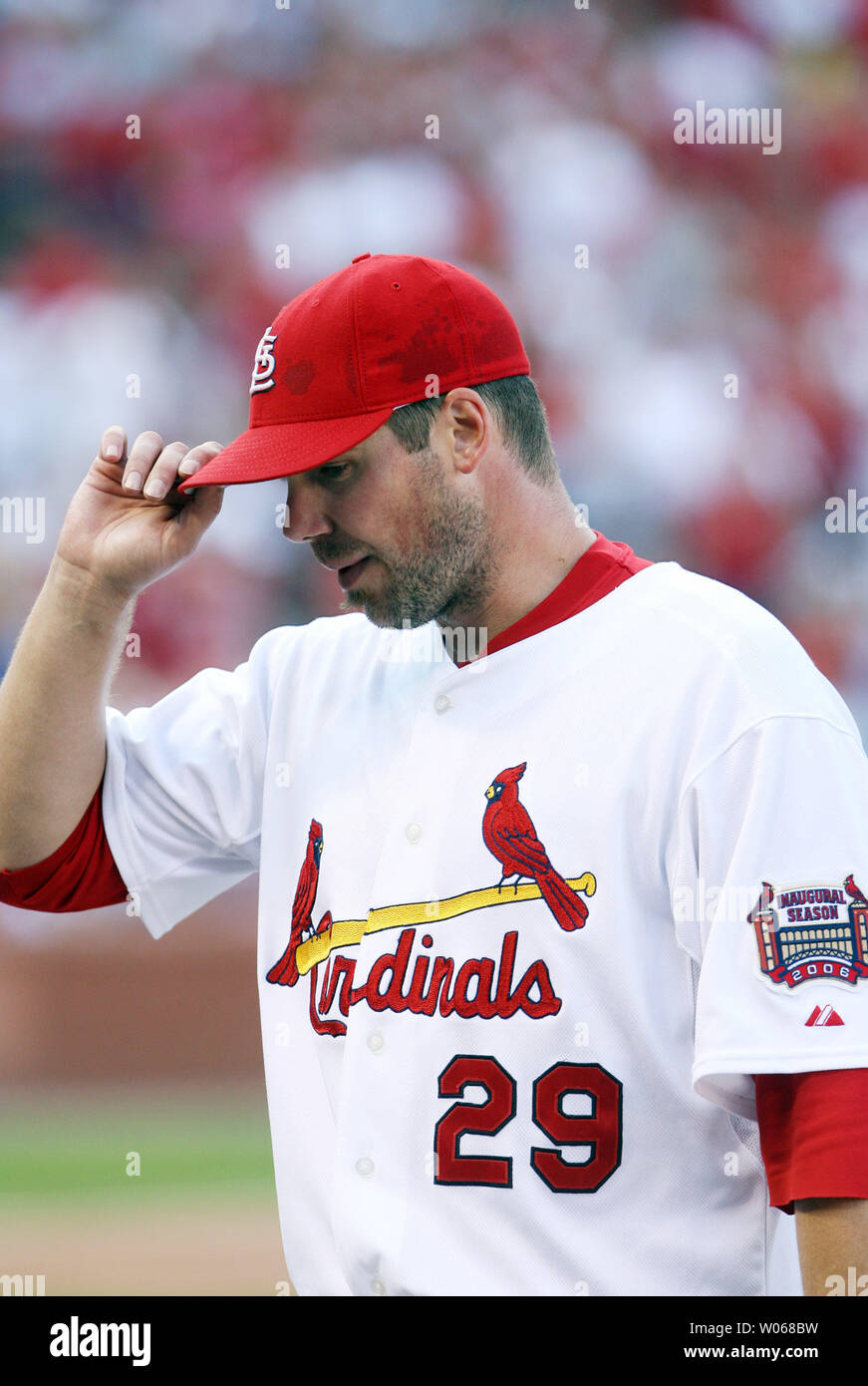 St. Louis Cardinals pitcher Chris Carpenter tips his cap to the cheering  crowd as he leaves the game against the Milwaukee Brewers in the seventh  inning at Busch Stadium in St. Louis