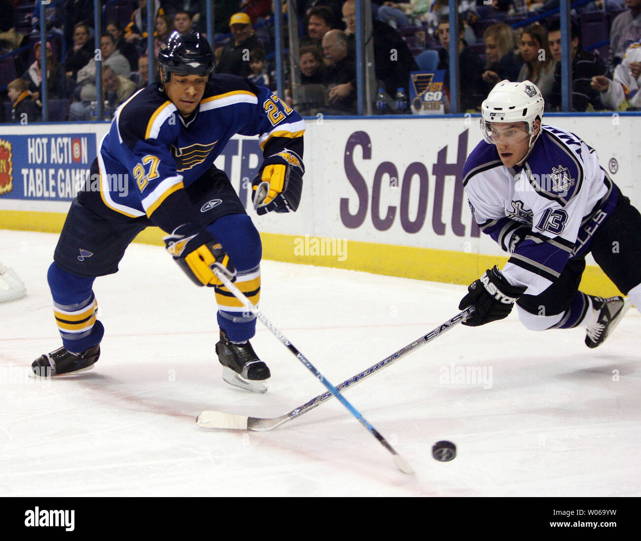 St. Louis Blues Bryce Salvador (L) tries to beat Los Angeles Kings Michael Cammalleri to the puck during the first period at the Scottrade Center in St. Louis on January 13, 2007. (UPI Photo/Bill Greenblatt) Stock Photo