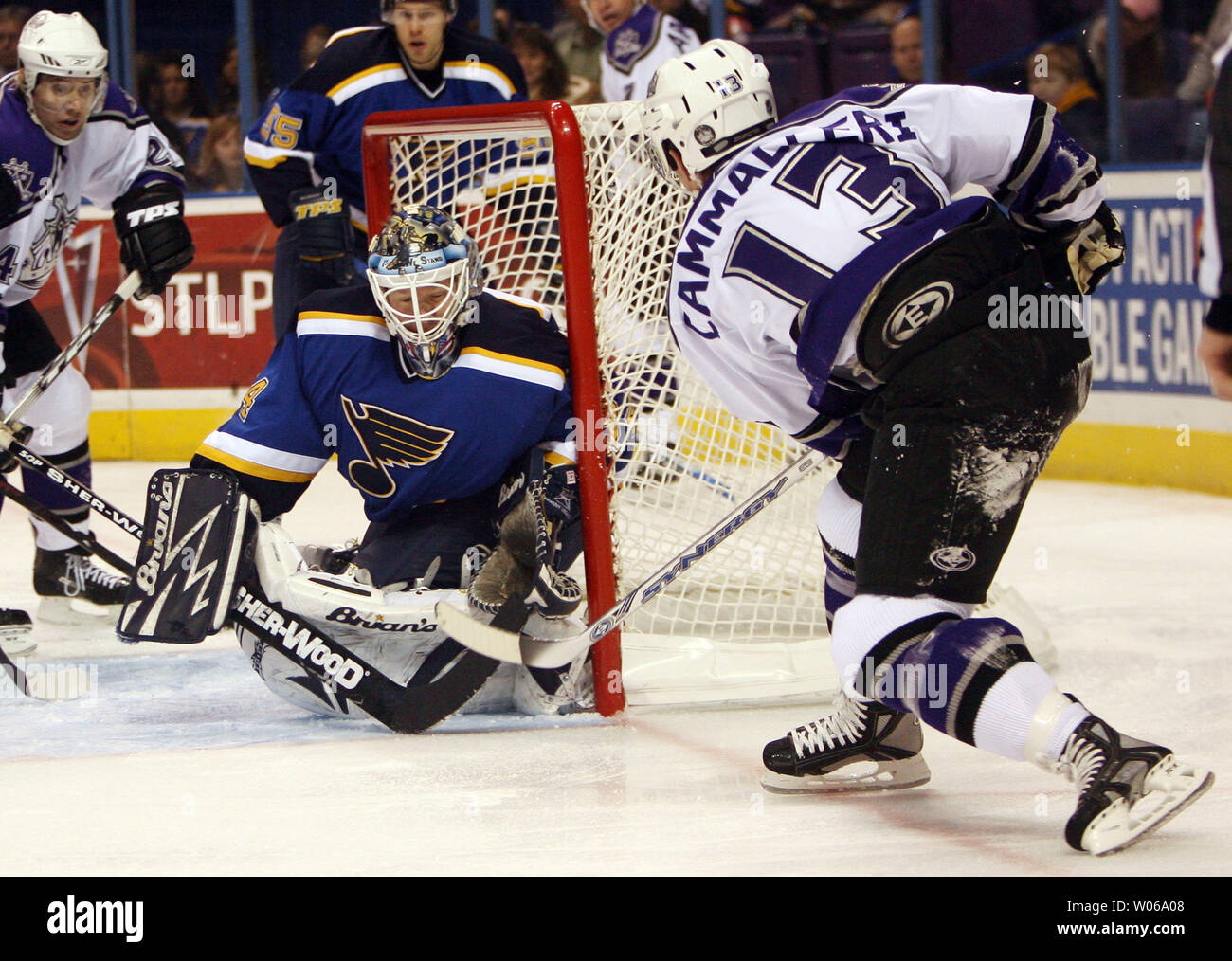 Los Angeles Kings Michael Cammalleri (13) sneaks the puck past St. Louis Blues goaltender Manny Legace for a goal in the first period at the Scottrade Center in St. Louis on January 13, 2007. (UPI Photo/Bill Greenblatt) Stock Photo