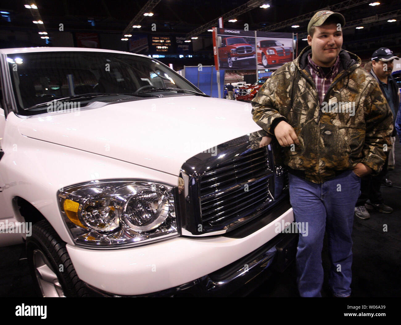 Mitchell Hults, the 15-year-old who identified the get-a-way vehicle used by kidnapper Michael Devlin to kidnap Ben Ownby on January 8, 2007, leans on the hood of a new truck given to him as a reward by Chrysler at the St. Louis Auto Show in St. Louis on January 24, 2007. Although only 15, Hults will turn 16 in six months and plans to use the $36 thousand vehicle to haul his ATV. (UPI Photo/Bill Greenblatt) Stock Photo