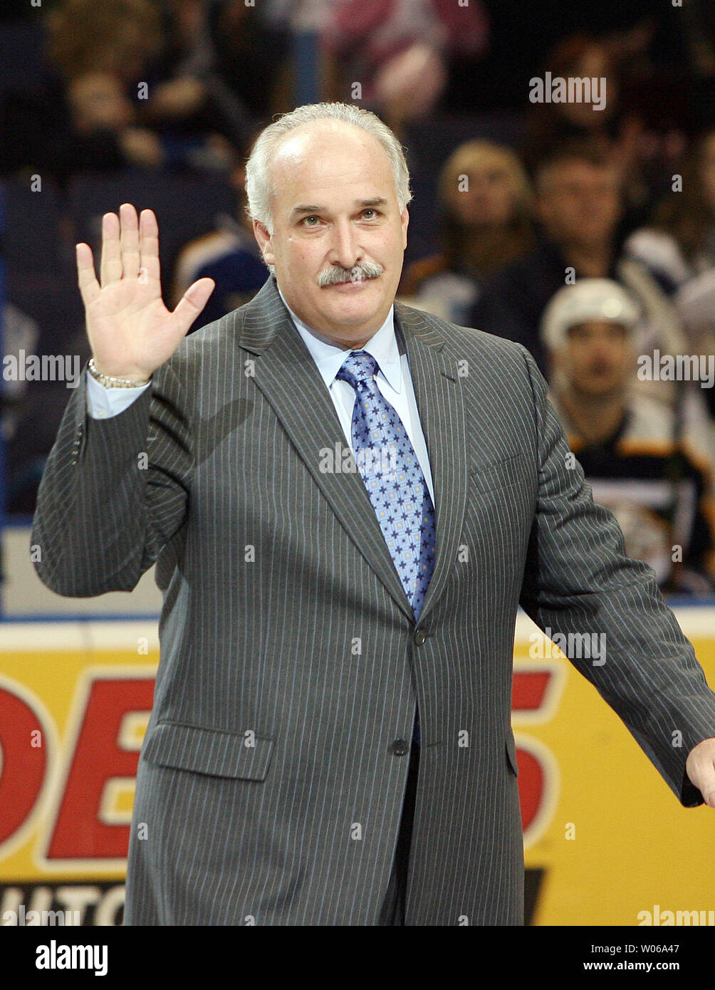 St. Louis Blues President John Davidson waves to the fans as he is