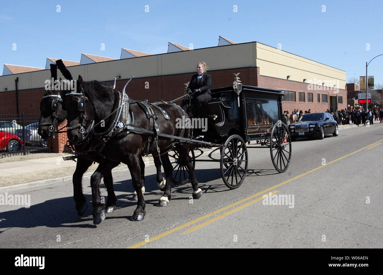 A horsedrawn carriage containing the casket of Denver Broncos running back Damien Nash, leaves the Friendly Temple Missionary Baptist Church enroute to a cemetery in St .Louis on March 5, 2007. Nash, 24, who is from St. Louis, died on February 24, after playing in a charity basketball game. (UPI Photo/Bill Greenblatt) Stock Photo