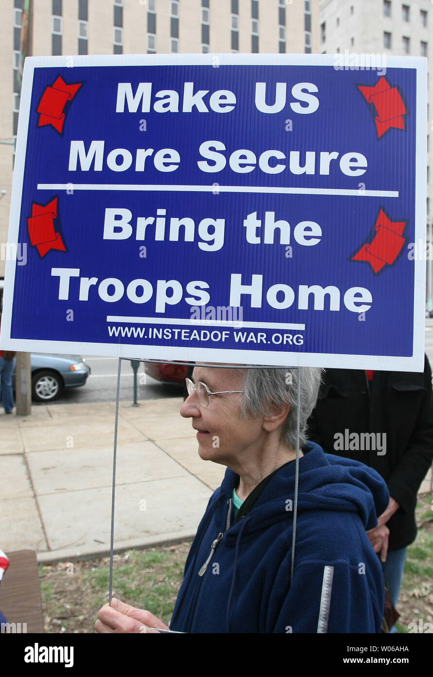 War protestor Mary Weller of Webster Groves, Missouri holds a sign before taking part in a peaceful march through the streets of downtown St. Louis during the fourth anniversary of the Iraq war in St. Louis on March 19, 2007. (UPI Photo/Bill Greenblatt) Stock Photo