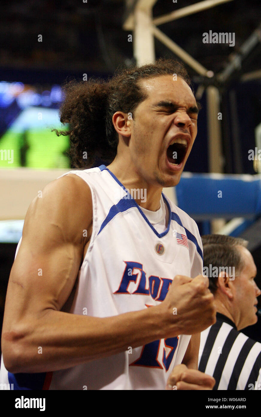Florida Gators Joakim Noah Pumps His Fists And Yells After Dunking The Basketball For Two Points In The First Half Against The Oregon Ducks In The Ncaa Midwest Regional At The Edward
