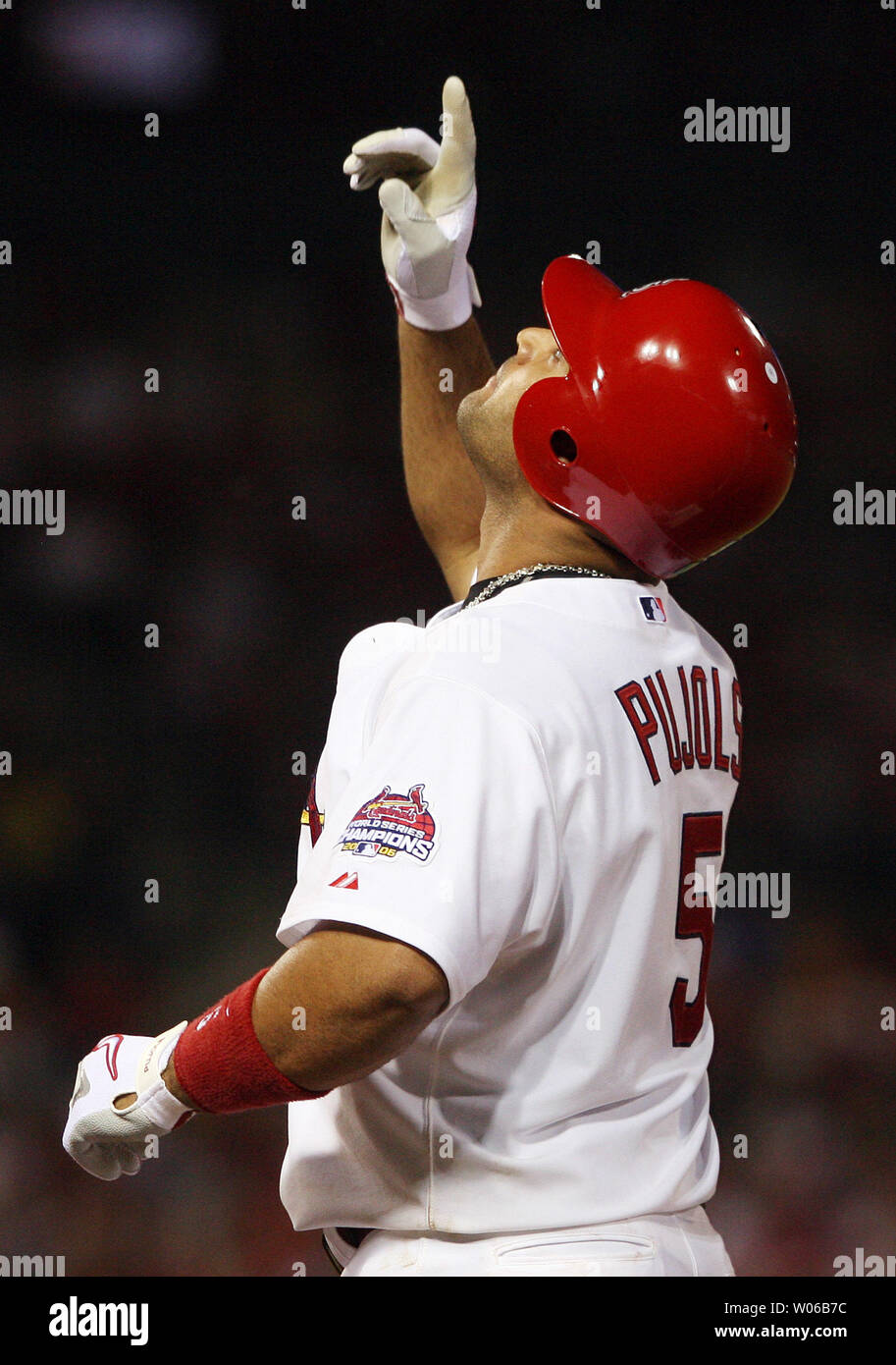 St. Louis Cardinals slugger Albert Pujols stops his autograph session to  sign for son A.J. (5) during the Cardinals Winter Warm-Up in St. Louis on  January 13, 2007. Over 25 thousand badges