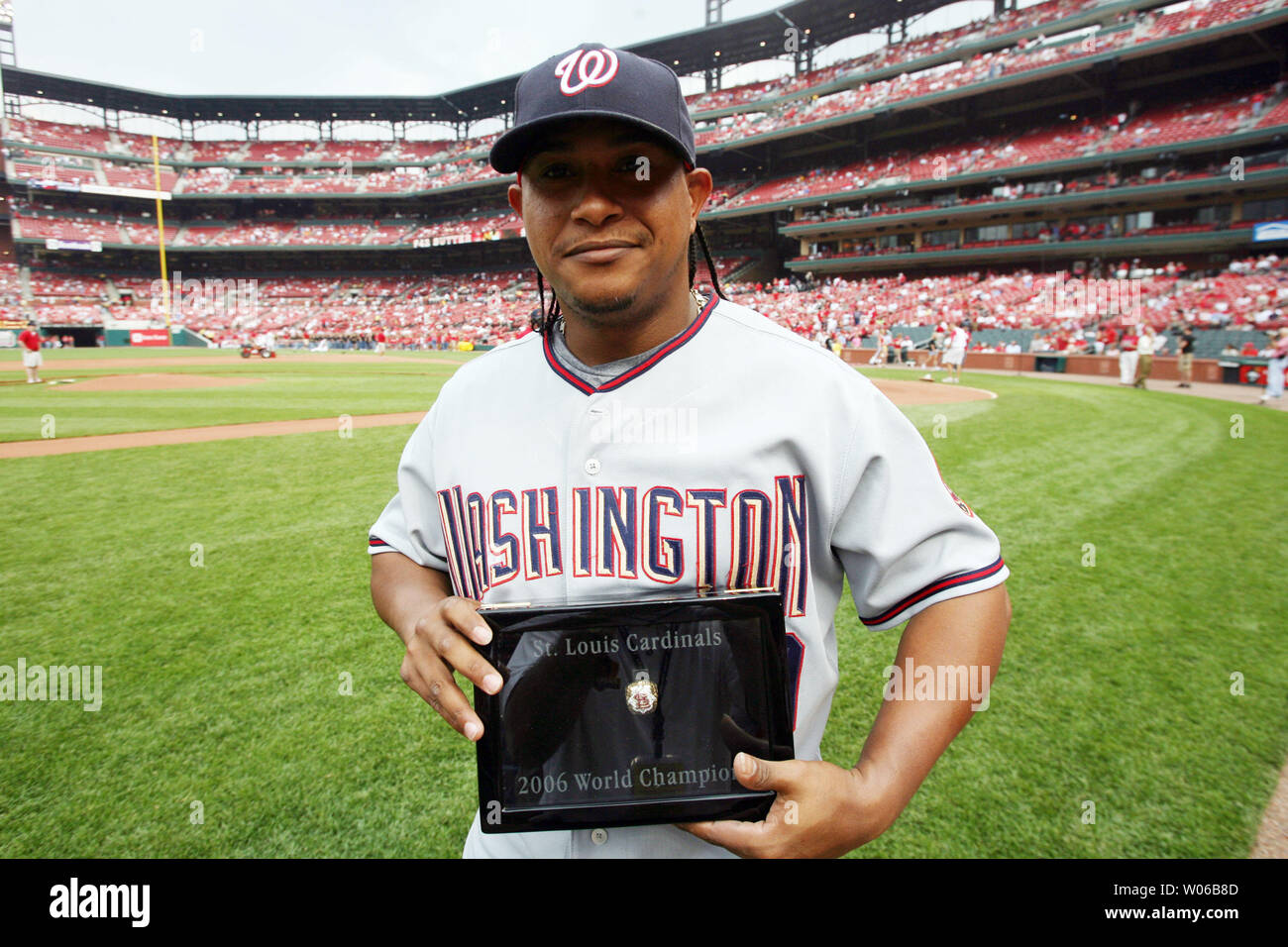Washington Nationals Ronnie Belliard shows off his World Series  Championship ring as he walks back to the dugout before a game against the  St. Louis Cardinals at Busch Stadium in St. Louis